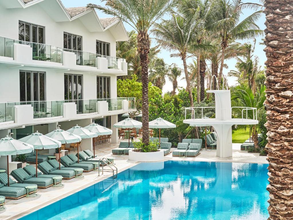 A shaded pool deck at a vintage Miami Beach hotel