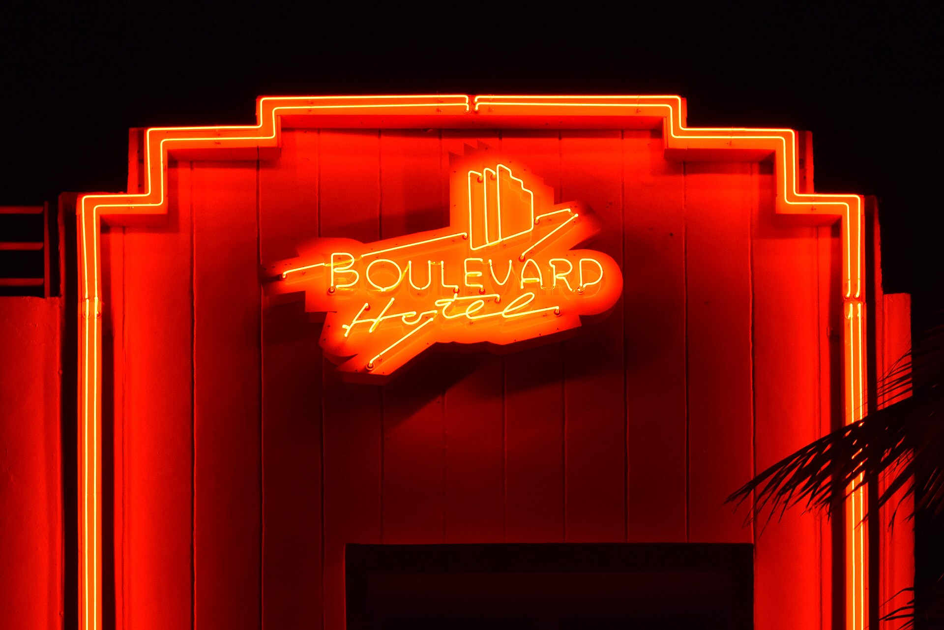 The red neon sign of the Boulevard Hotel at night